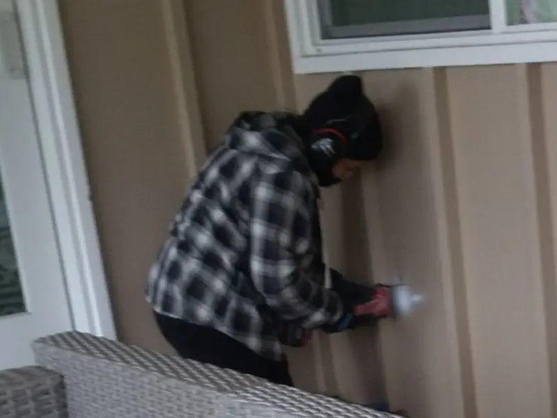 Professional electrician installing an exterior outlet in Rockfish