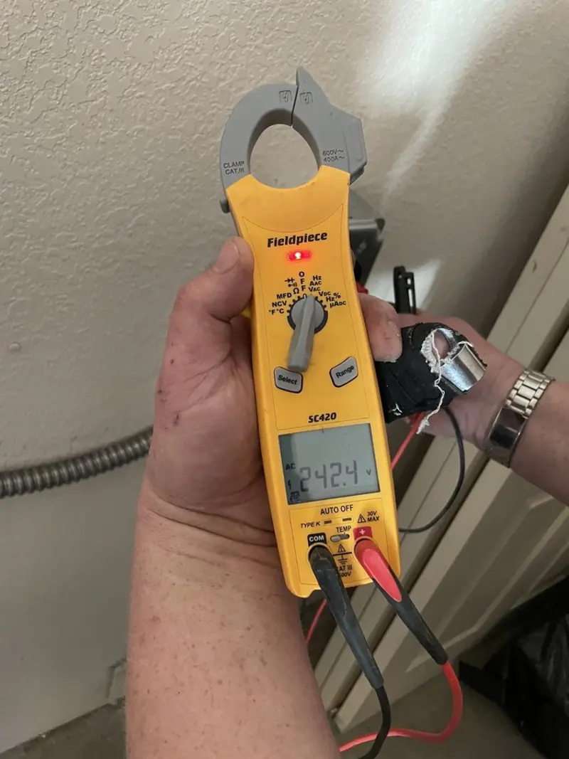 Voltage testing with clamp meter during Electrical Installation Services in Rockfish